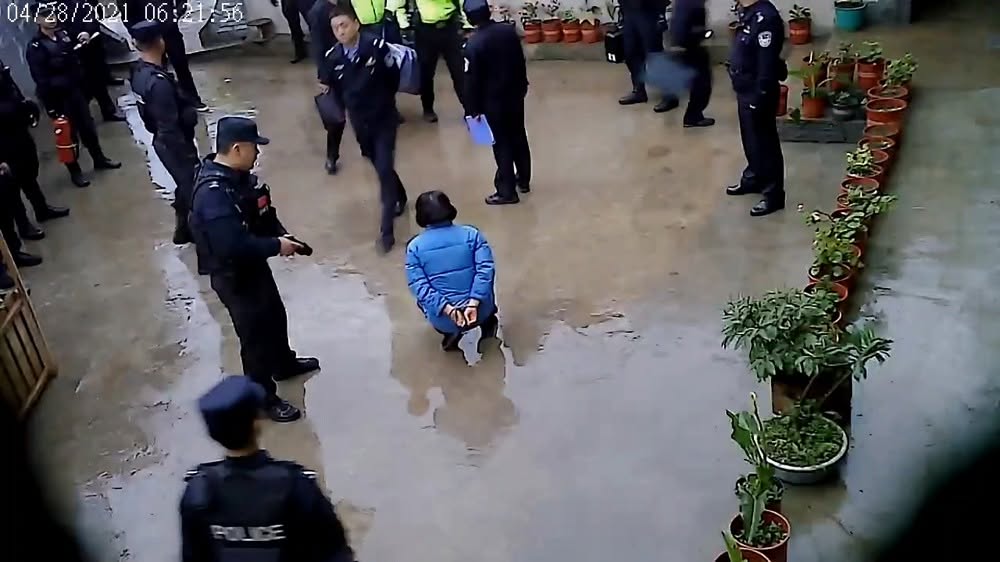 CCTV surveillance screenshot showing hundreds of fully armed police and special forces storming the  ...